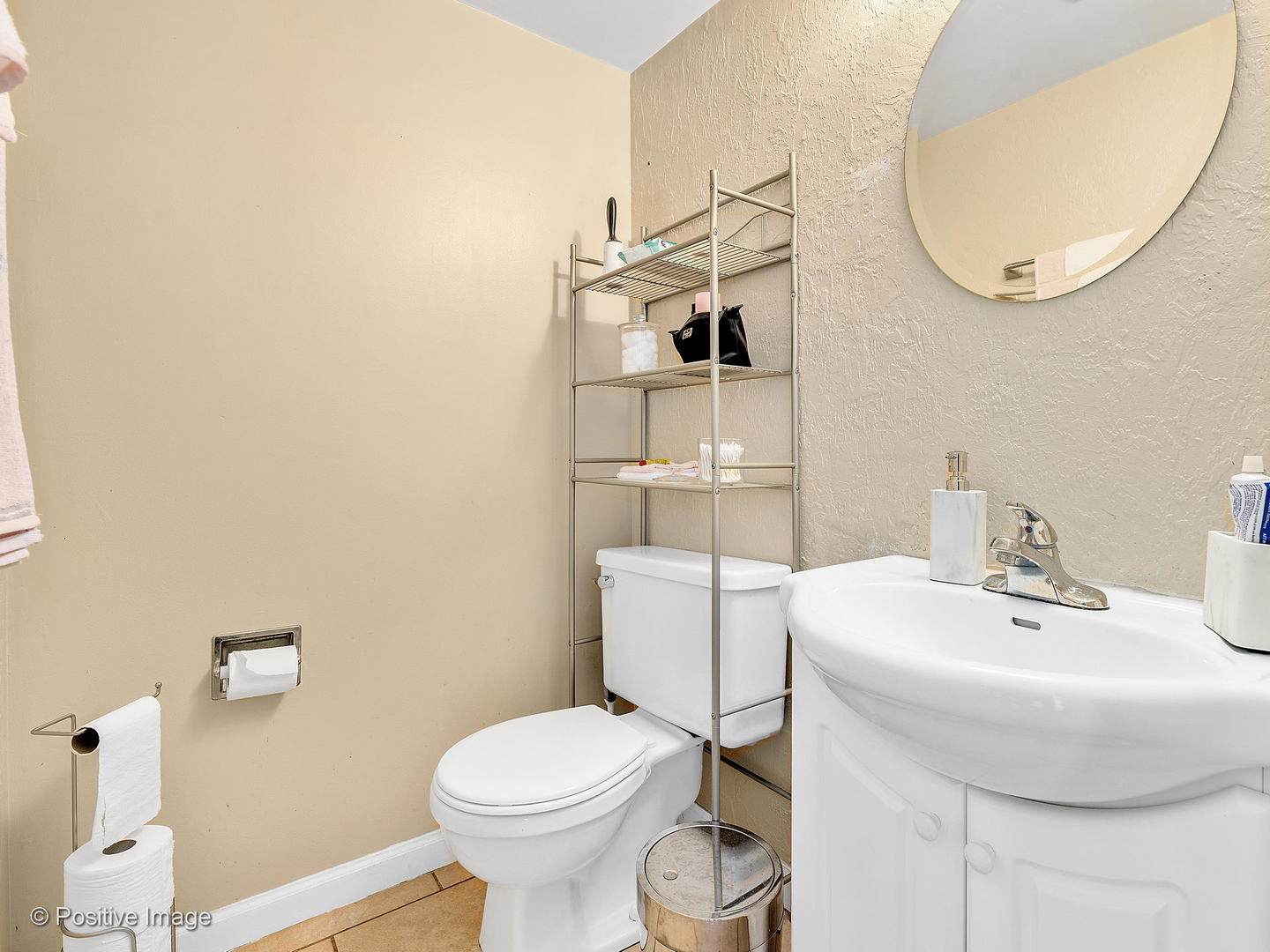 773 High Ridge Road Roselle, IL 60172 - Photo 16 of 18 a bathroom with a sink a toilet and a mirror