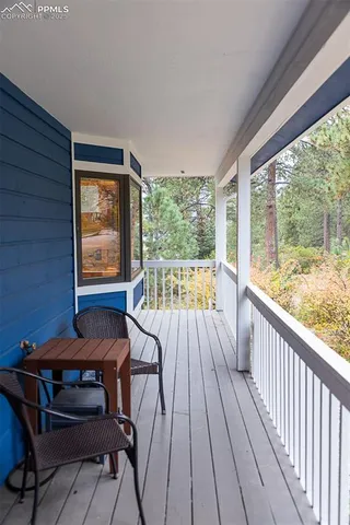 a view of a two chairs in the balcony
