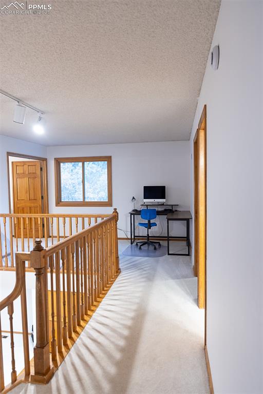 555 Hidden Marsh Road Monument, CO 80132 - Photo 36 of 47 a view of a livingroom with workspace and a window