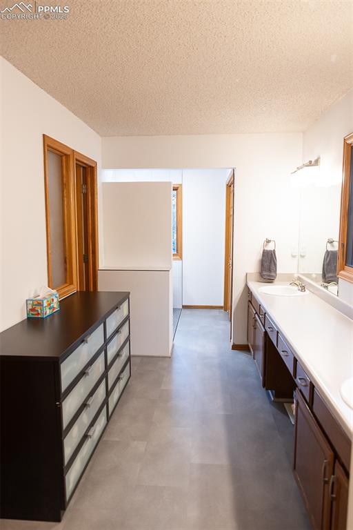 555 Hidden Marsh Road Monument, CO 80132 - Photo 41 of 47 a bathroom with a sink and a mirror