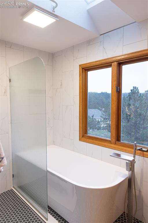 555 Hidden Marsh Road Monument, CO 80132 - Photo 42 of 47 a bath tub sitting next to a window