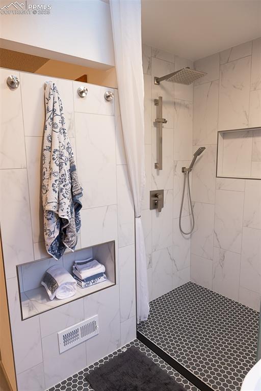555 Hidden Marsh Road Monument, CO 80132 - Photo 43 of 47 a bathroom with a sink and a mirror