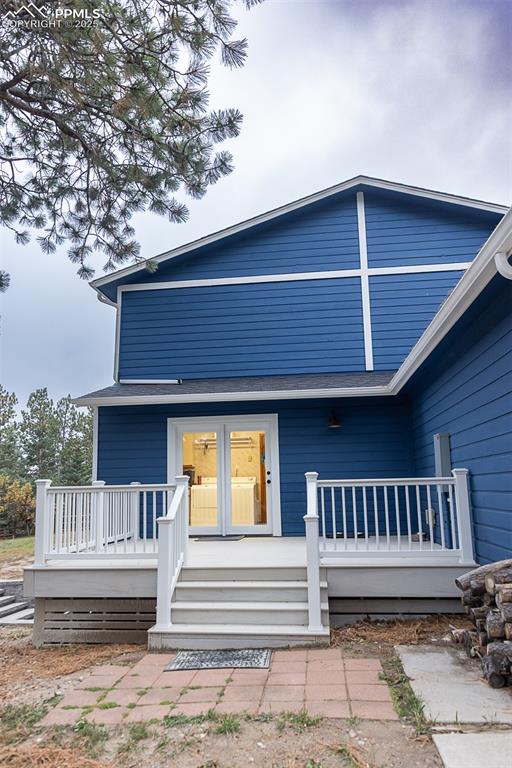 555 Hidden Marsh Road Monument, CO 80132 - Photo 44 of 47 a view of a house with a deck