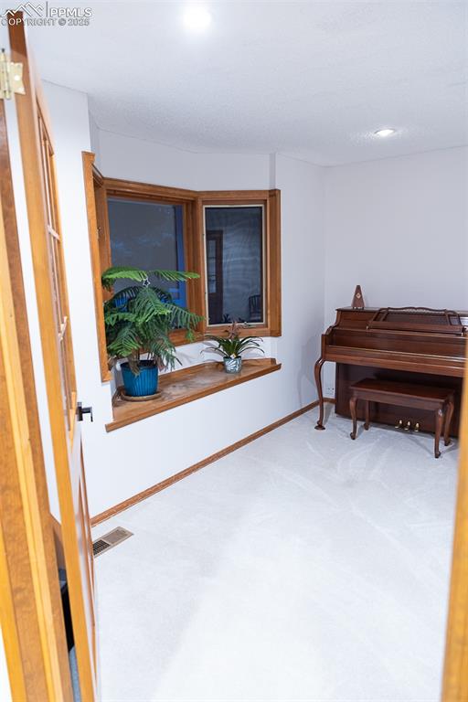 555 Hidden Marsh Road Monument, CO 80132 - Photo 6 of 47 a living room with furniture and a window