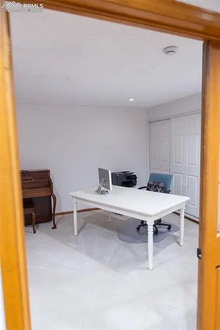 a room with a table and chairs