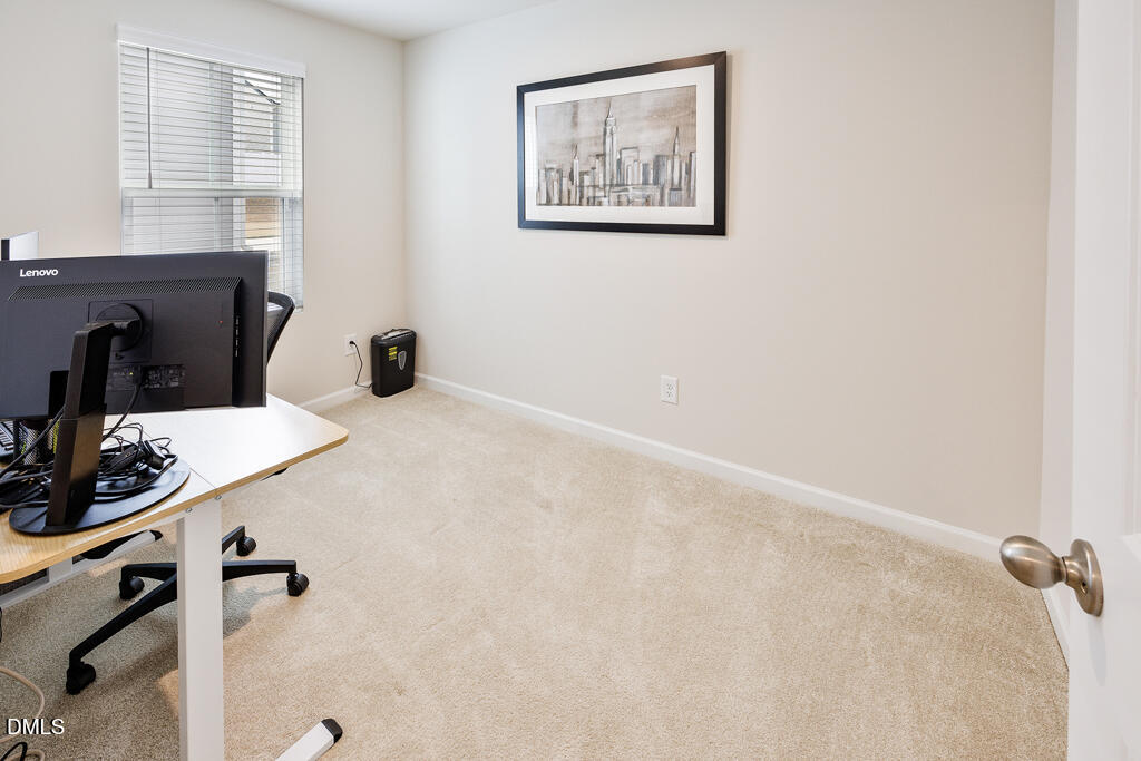 4468 Captain Falls Drive Raleigh, NC 27610 - Photo 13 of 36 a view of a room with gym equipment