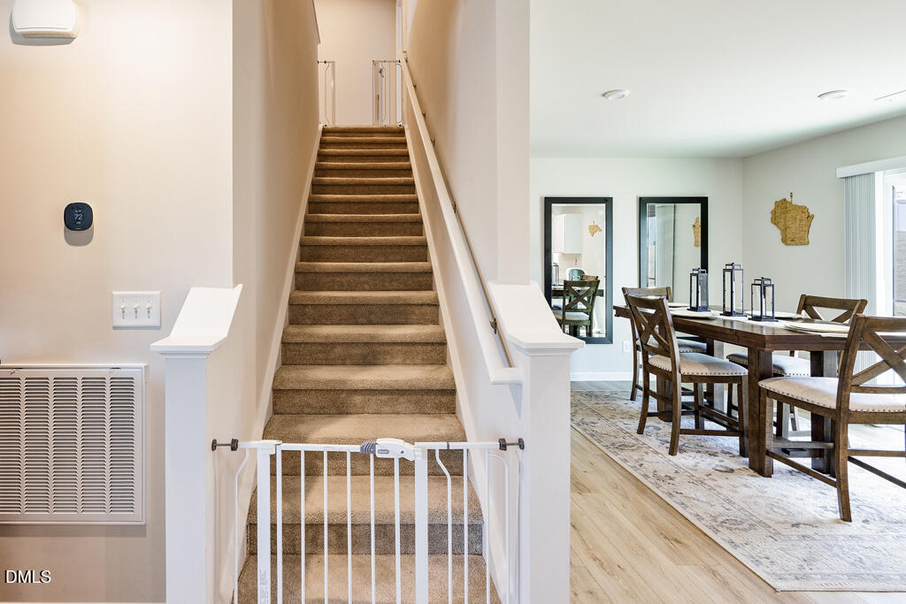 4468 Captain Falls Drive Raleigh, NC 27610 - Photo 15 of 36 a view of a dining room with furniture and entryway