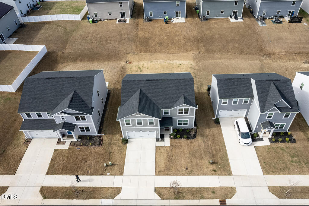 4468 Captain Falls Drive Raleigh, NC 27610 - Photo 30 of 36 a picture of a living room with a fireplace