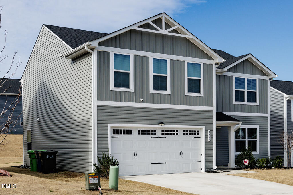 4468 Captain Falls Drive Raleigh, NC 27610 - Photo 36 of 36 a front view of a house with garage