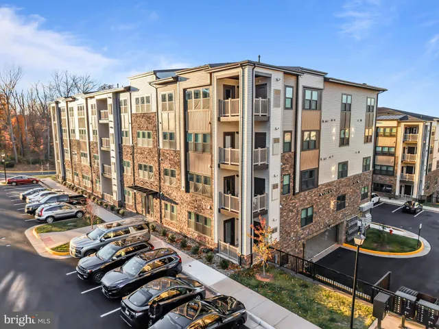 a front view of a building with outdoor seating