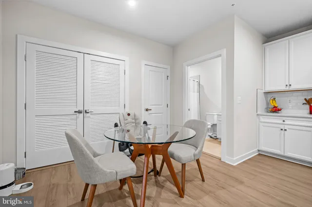 a view of a dining room with furniture and wooden floor