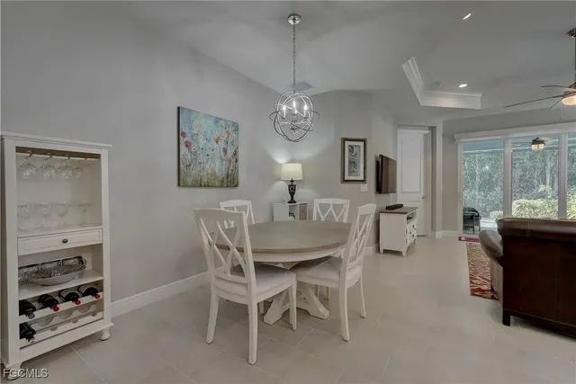 a living room with furniture a large window and a flat screen tv