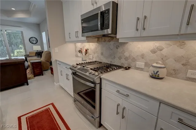 a bedroom with a bed and a ceiling fan