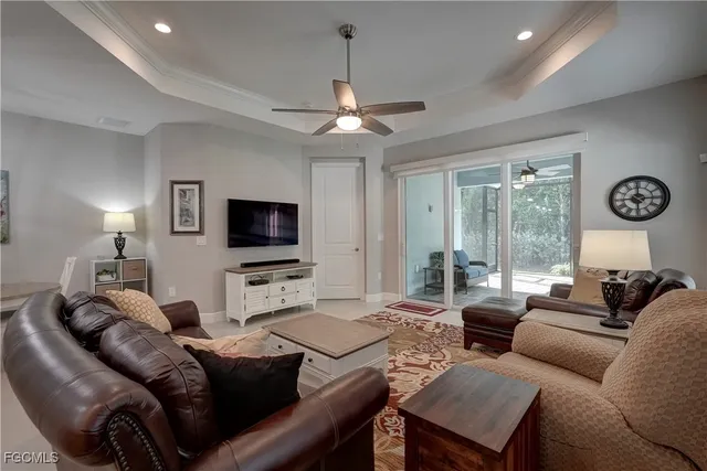 a view of a hallway with wooden floor and a bathroom