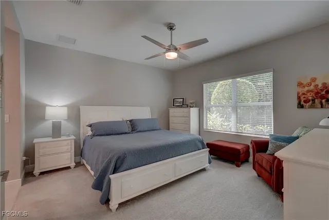 a view of a porch with chairs and a yard