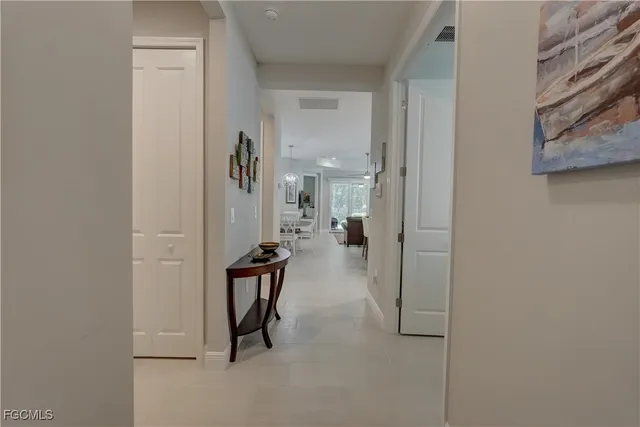 a view of a livingroom with workspace and a couch