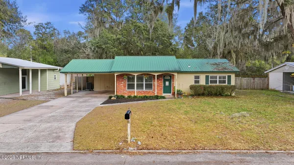 front view of a house with a yard