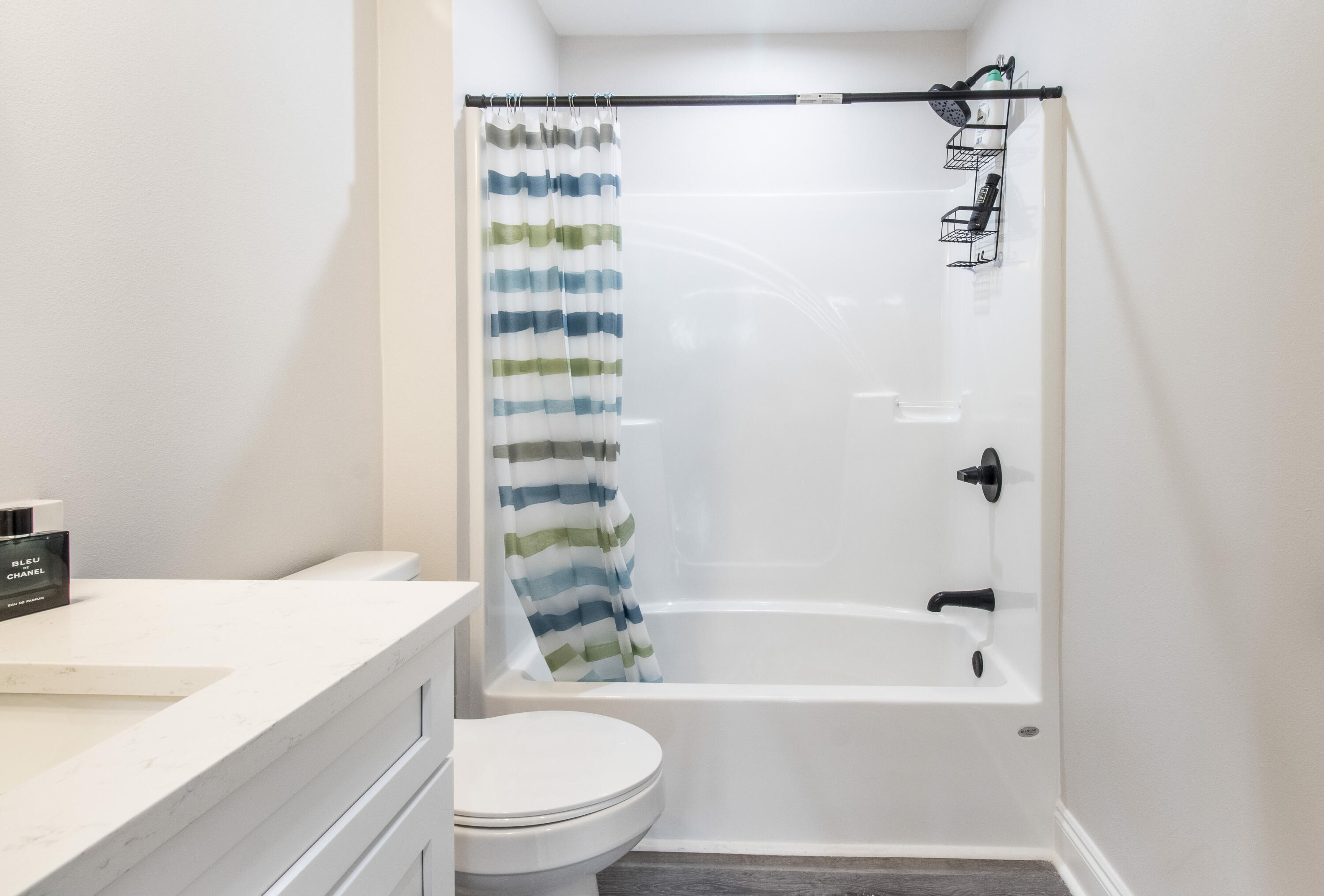5374 Highview Drive Crestview, FL 32539 - Photo 11 of 12 a bathroom with a bathtub shower sink vanity and a toilet