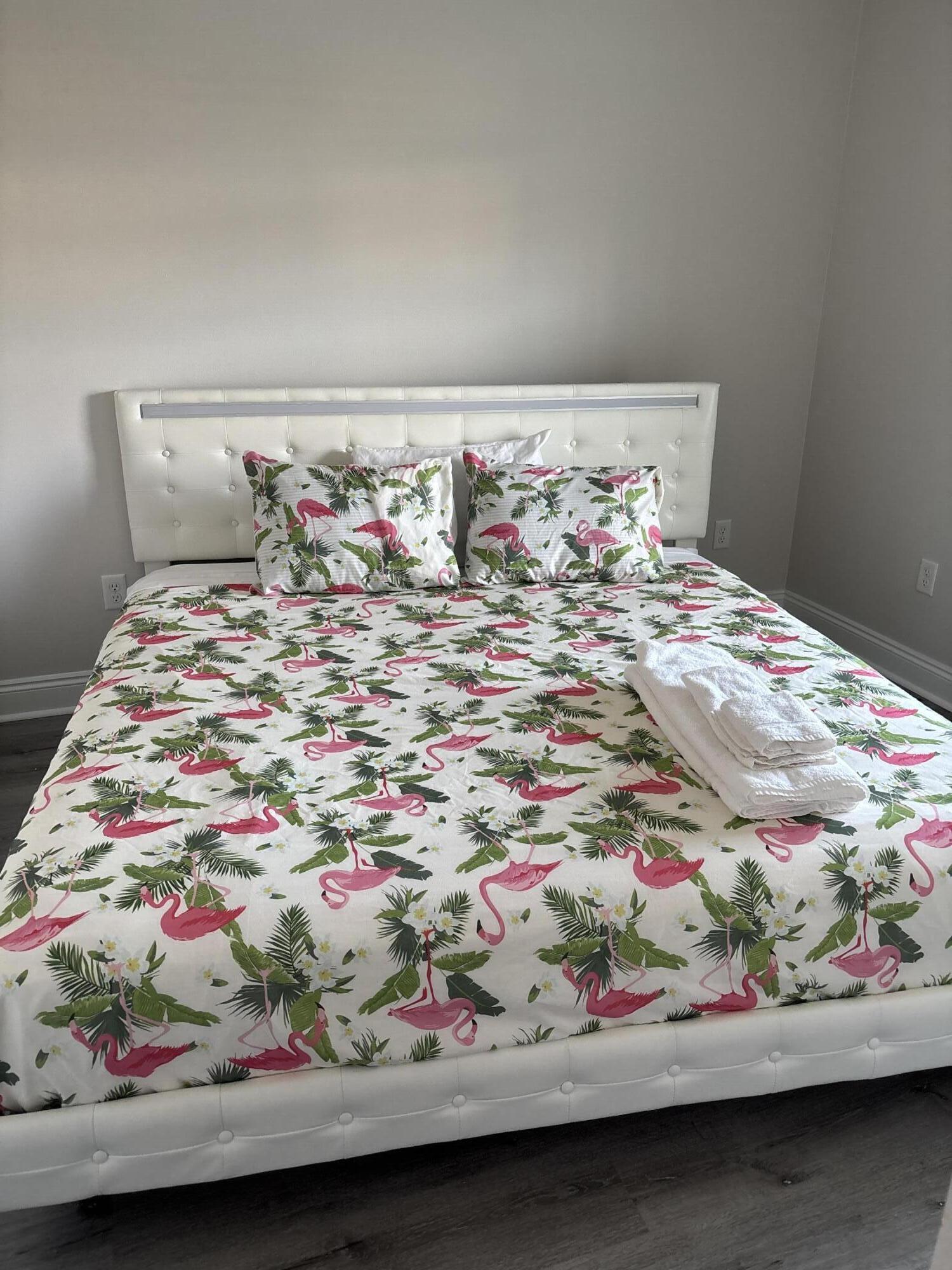 5374 Highview Drive Crestview, FL 32539 - Photo 7 of 12 a white bed sitting in a bedroom next to a cabinet