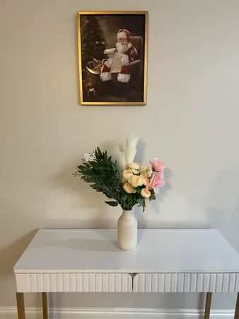 a bathroom with a bathtub shower sink vanity and a toilet