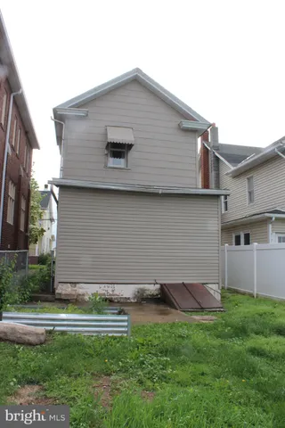 a kitchen with a refrigerator and cabinets