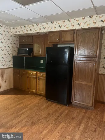 a kitchen with stainless steel appliances granite countertop a sink and a stove