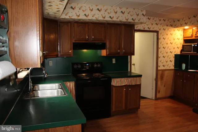 a view of kitchen with wooden floor