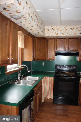 a bathroom with a sink toilet and mirror