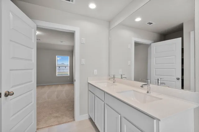 a bathroom with a bathtub and a sink