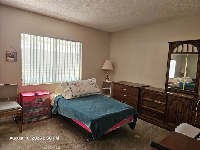 a bathroom with a granite countertop toilet sink and shower