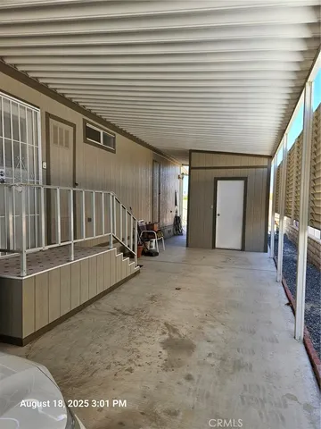 a view of a patio with table and chairs