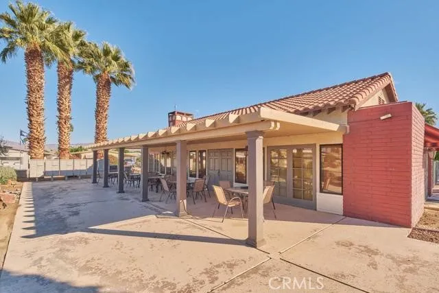 a front view of house with a garden