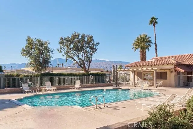 a balcony with table and chairs