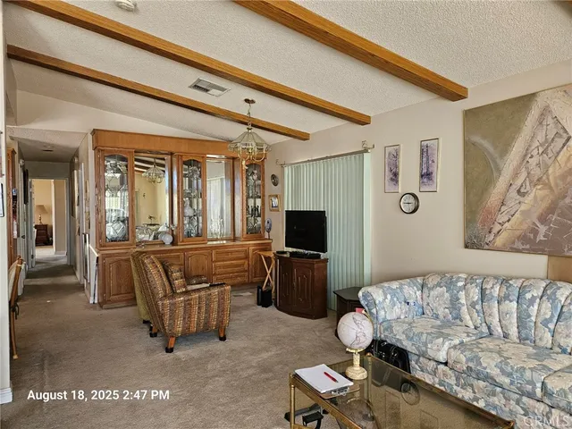 a kitchen with kitchen island granite countertop a sink stove and cabinets