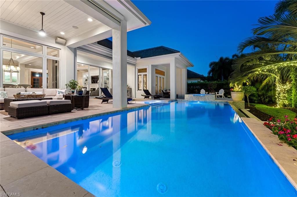 2301 Crayton Road Naples, FL 34103 - Photo 27 of 32 a view of swimming pool with outdoor seating