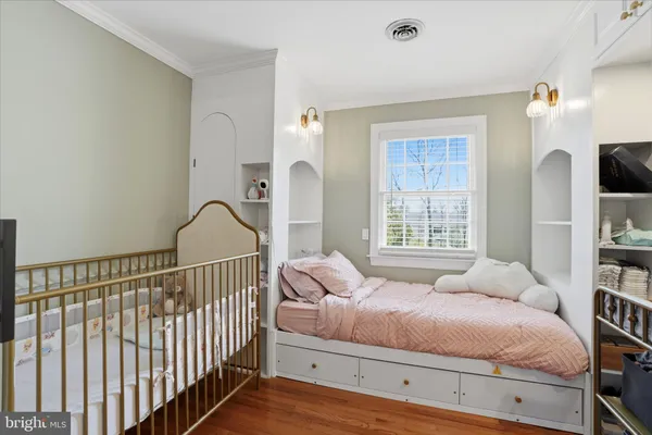 a bedroom with bed and a window