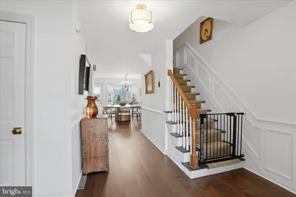 a view of a livingroom with furniture and staircase