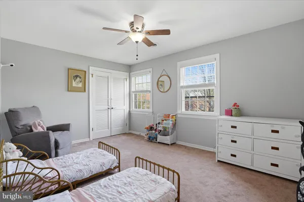 a bedroom with furniture and a window