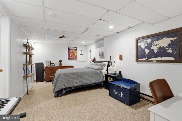 a bedroom with a bed a desk and chair
