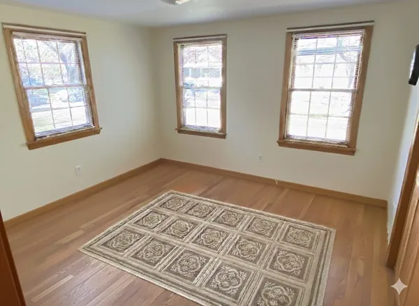a view of an empty room with windows
