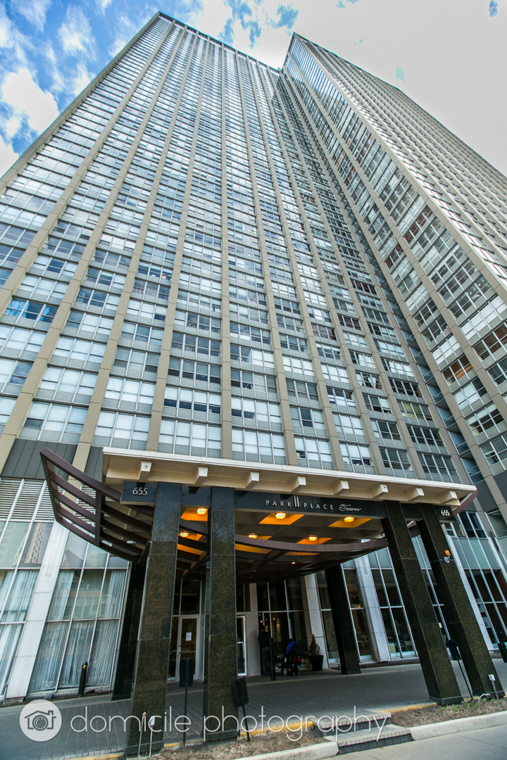 a view of barbeque area with seating area