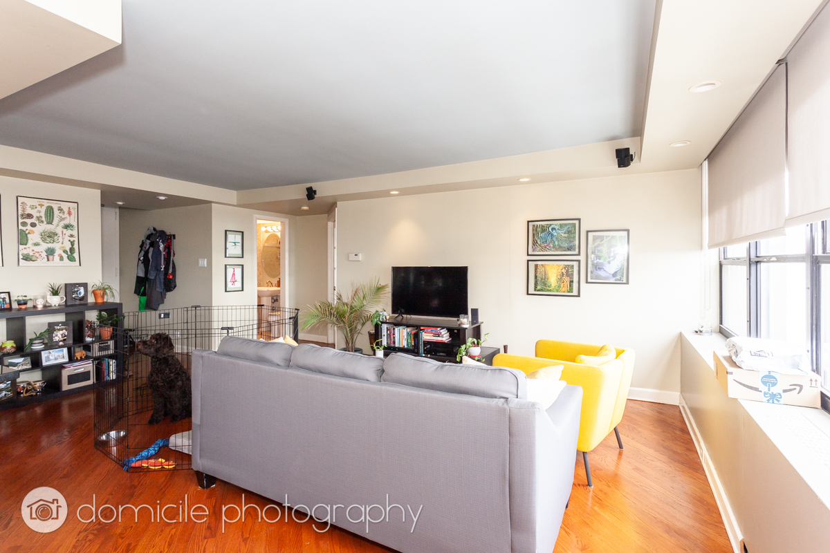655 West Irving Park Road, Unit 3103 Chicago, IL 60613 - Photo 5 of 18 a living room with furniture and a flat screen tv
