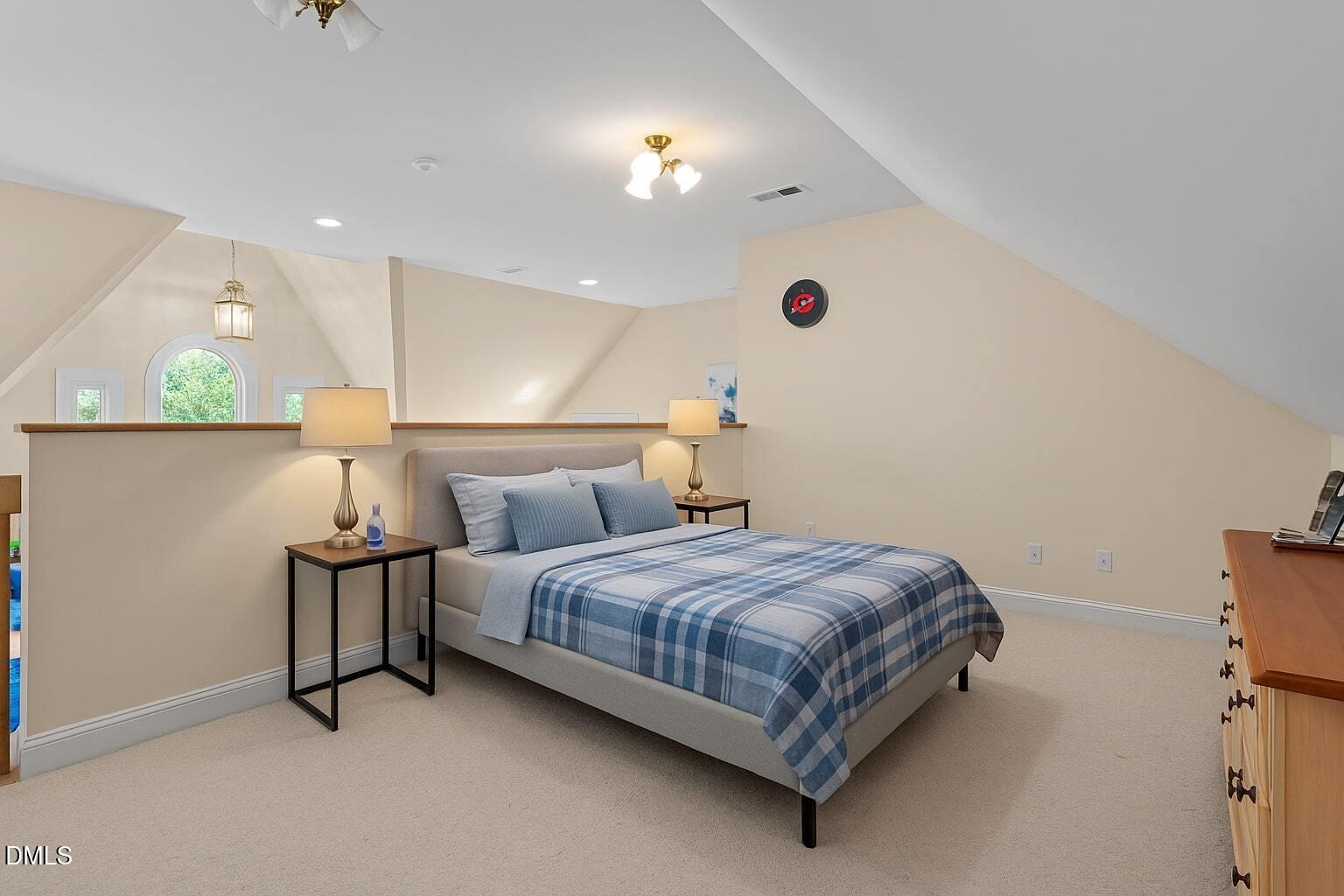5870 Hoyt Road Middlesex, NC 27557 - Photo 20 of 33 a bedroom with a bed and lamp
