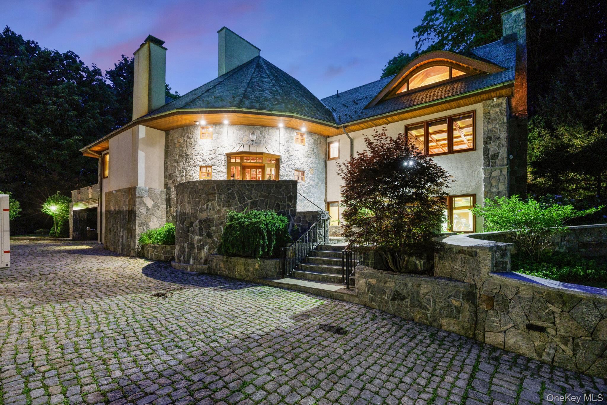 23 Inningwood Road Ossining, NY 10562 - Photo 43 of 50 Stone and stucco exterior featuring multiple gables and a rounded turret with a slate roof