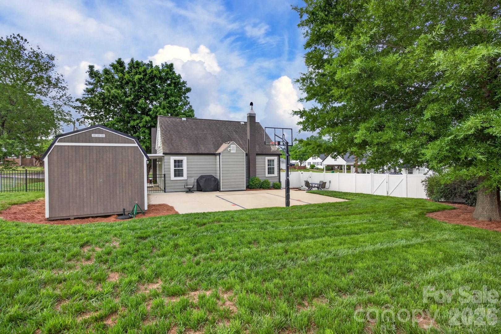 1016 Raney Street Salisbury, NC 28146 - Photo 28 of 45 a view of a house with a yard and a large tree