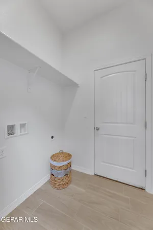 a view of a room that has a bench and a window