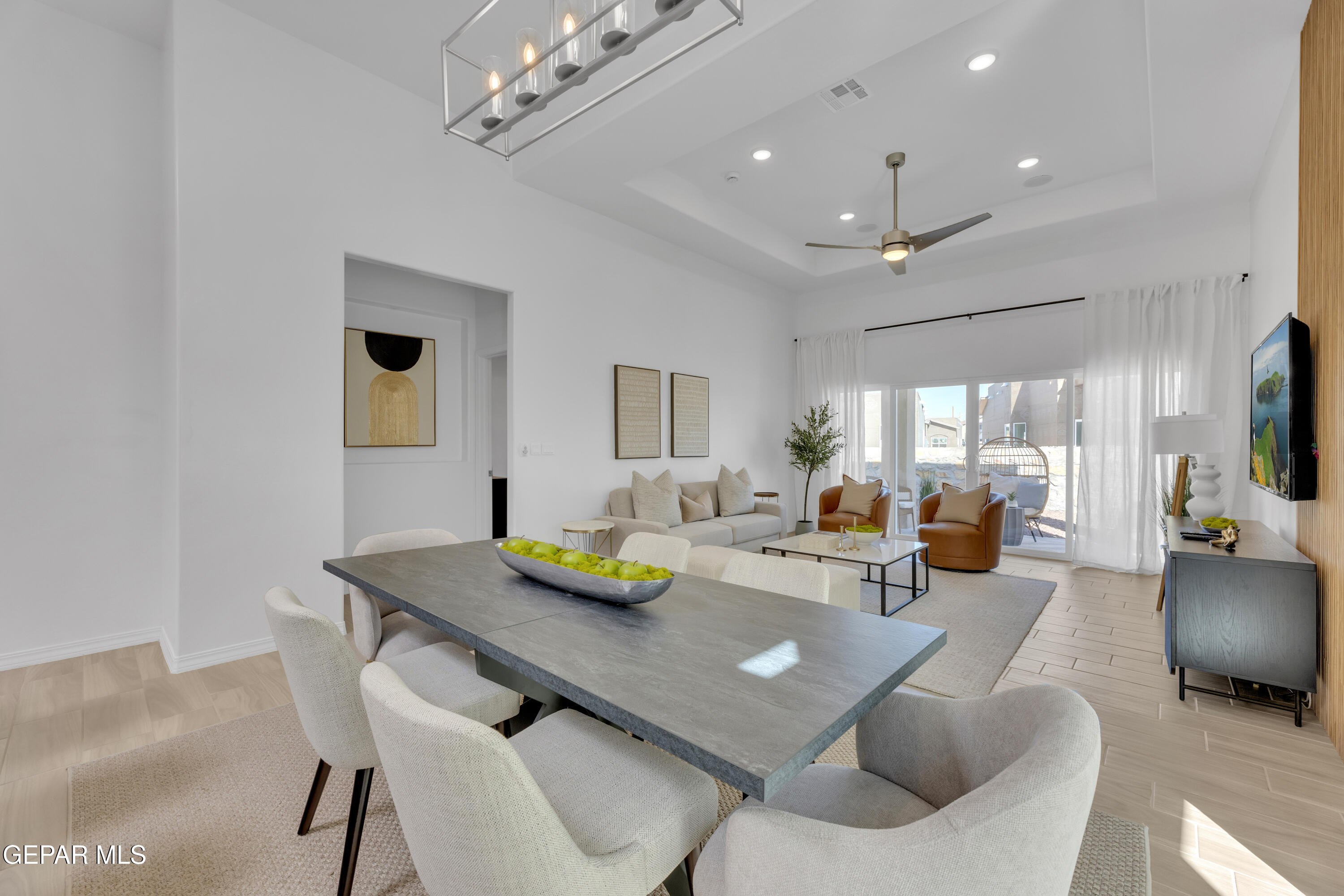 6026 Fall Ridge Sunland Park, NM 88008 - Photo 3 of 31 a view of a dining room with furniture and a chandelier