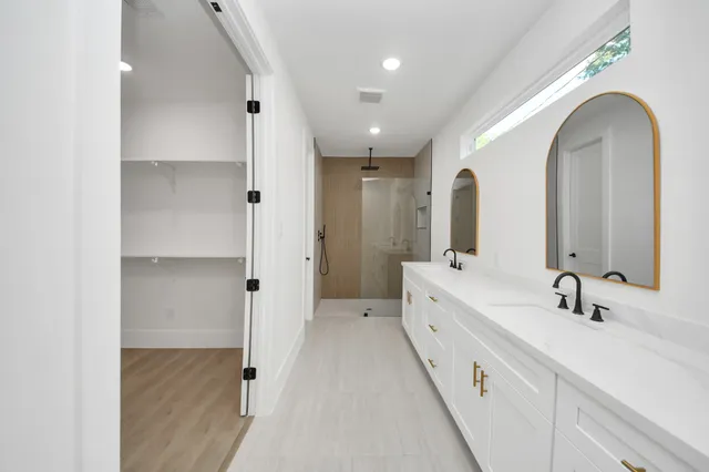 a bathroom with 2 sink and a mirror