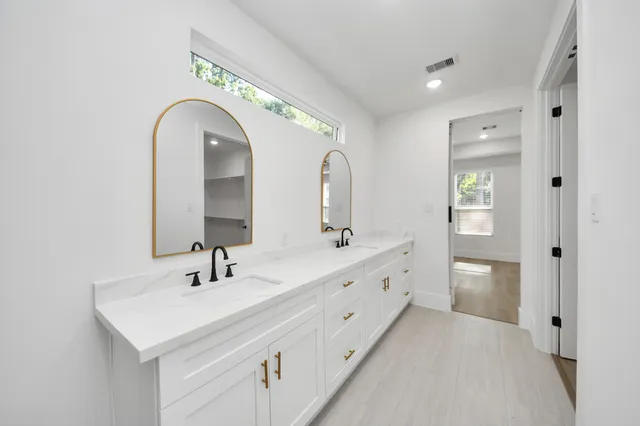 a large room with a window and wooden floor