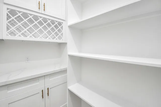 a view with a sink and cabinets